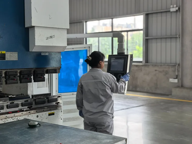 About Huasheng 3 Huasheng worker operating a machine